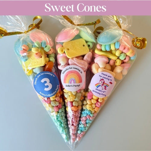 Colorful candy sweet cones with personalised stickers on a light background